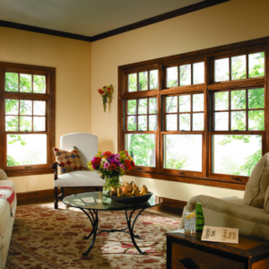 A living room with wood-framed double-hung windows.