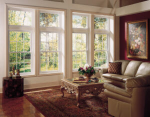 A living room with large vinyl windows.